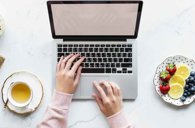 person using macbook pro