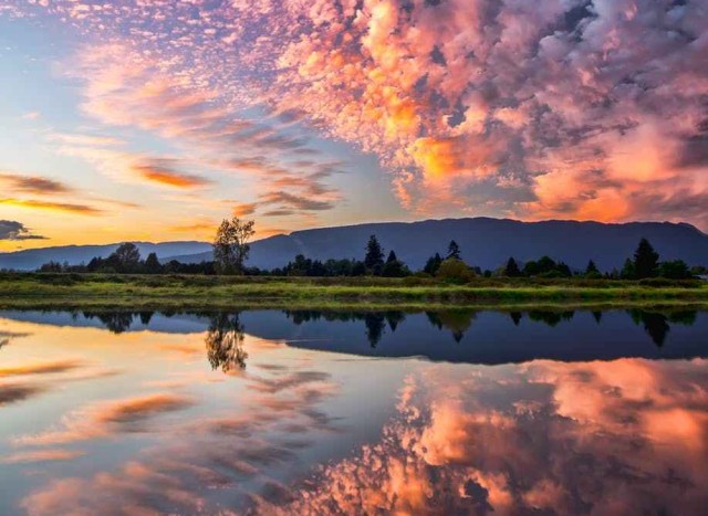 symmetrical photography of clouds covered blue sky