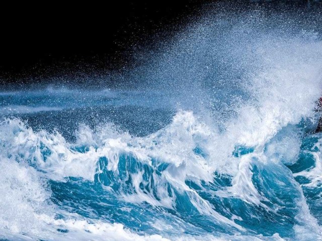 person riding on surfboard