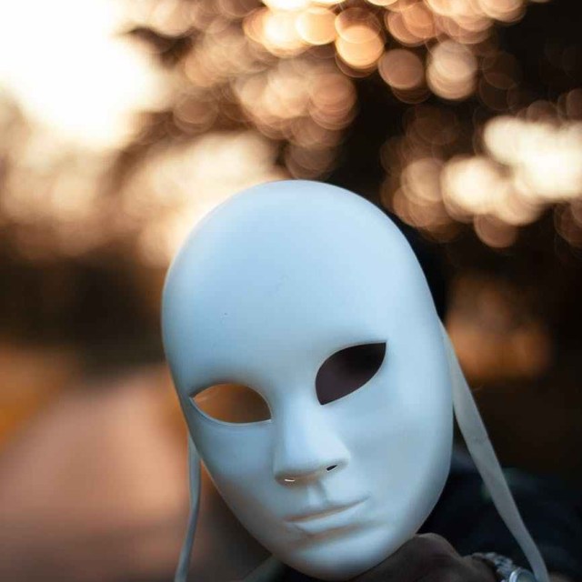 focus photography of white mask