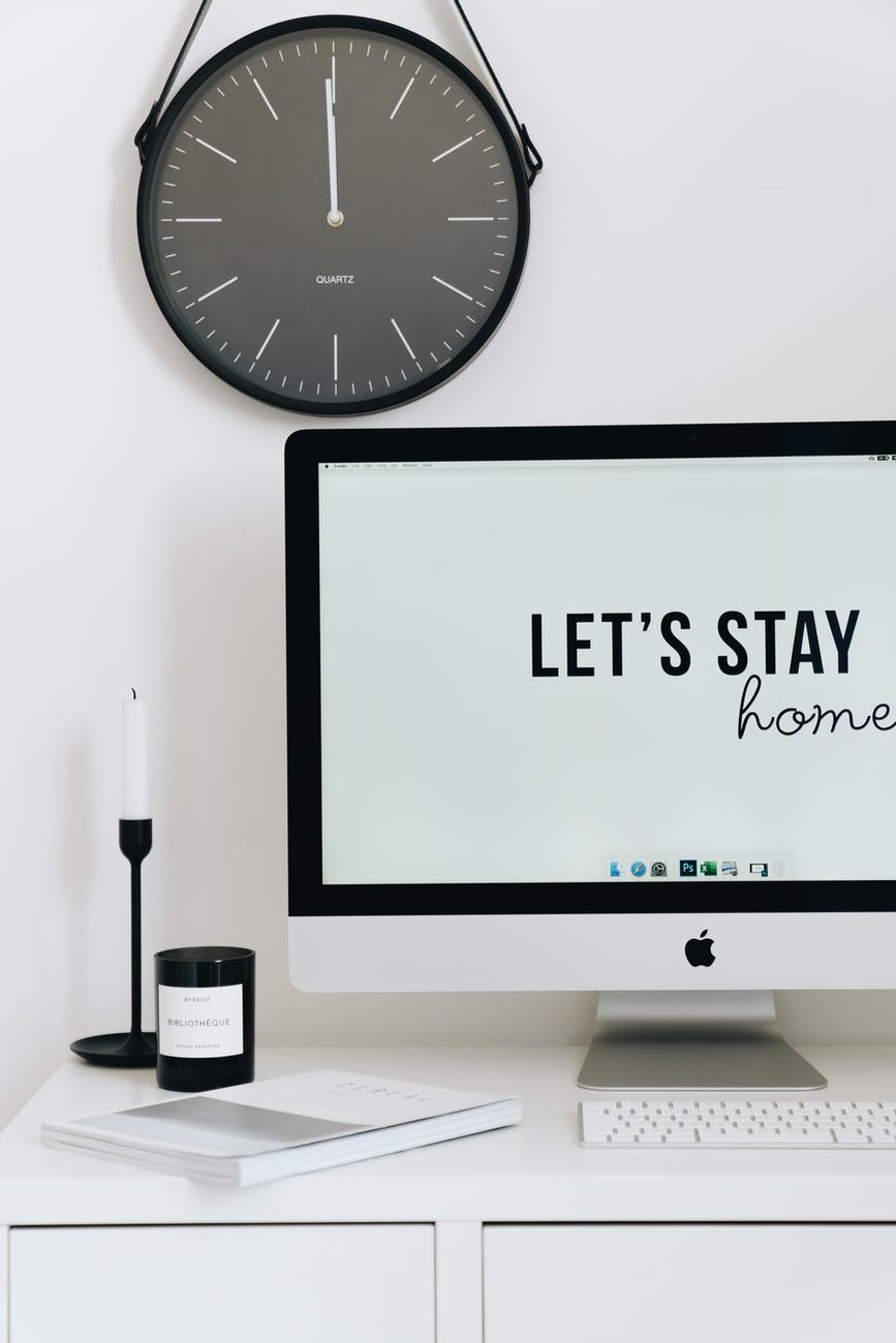 silver imac on white table