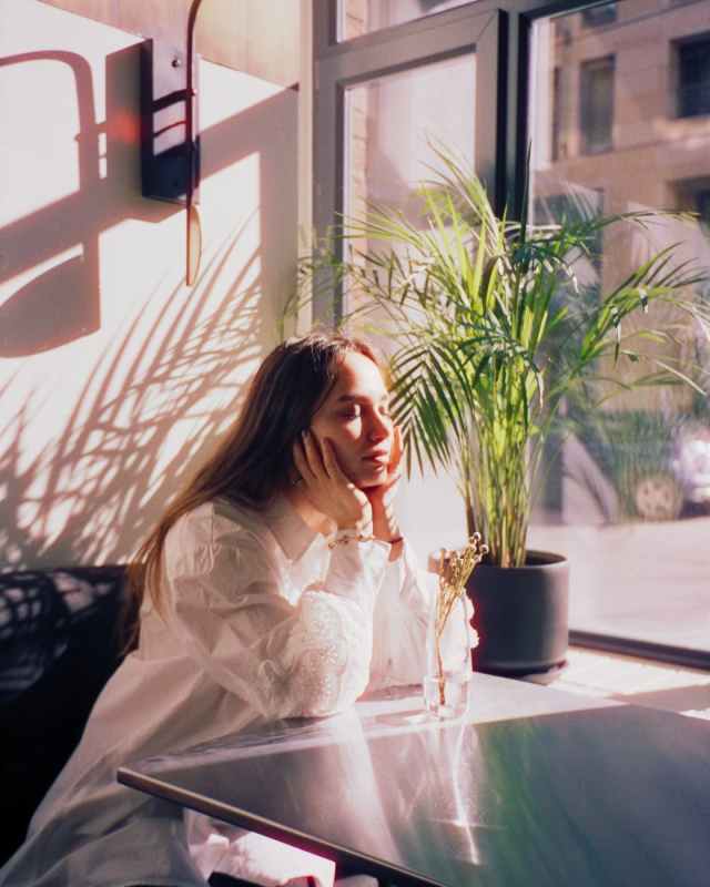 girl sitting on table