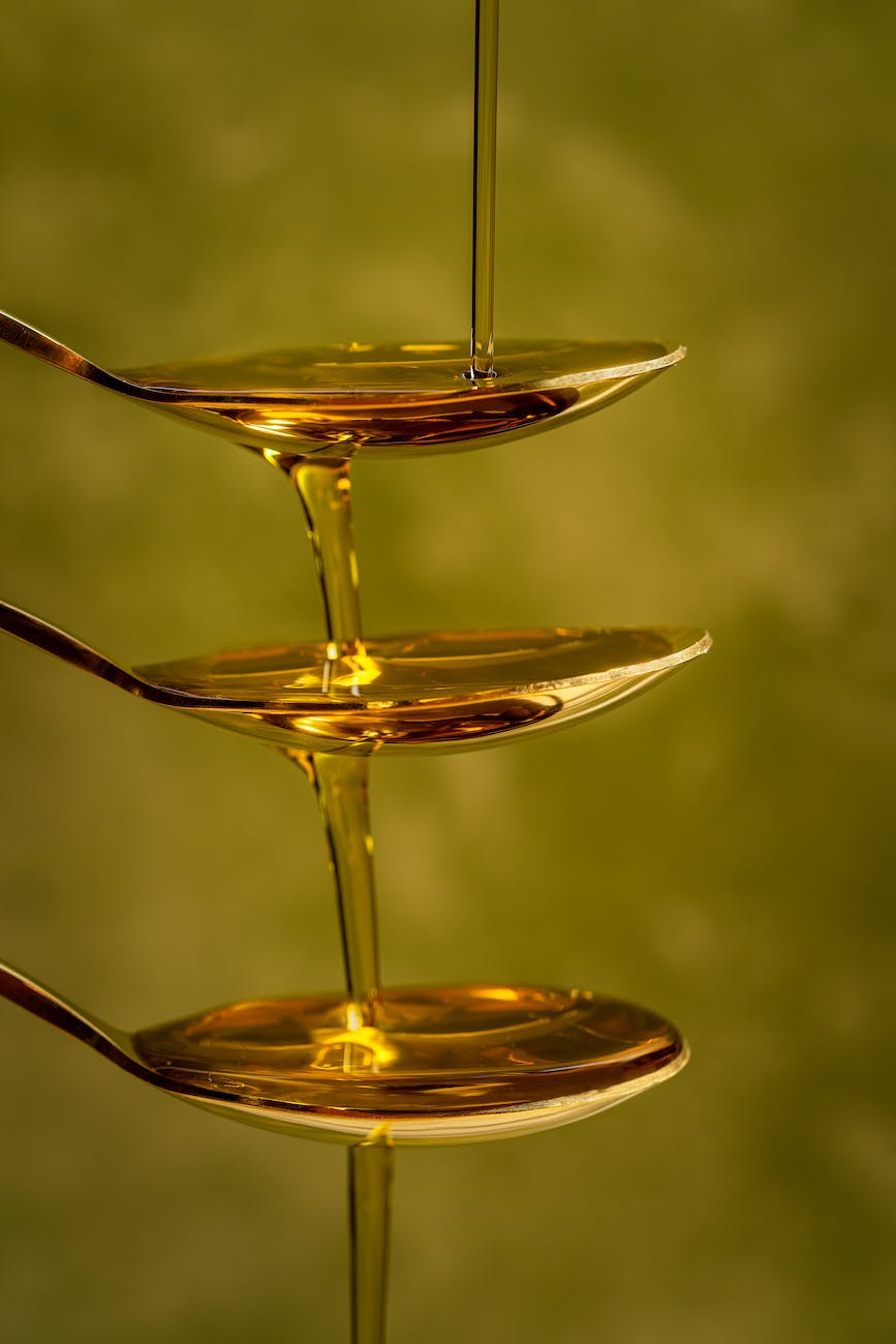 photo of honey dripping from spoons