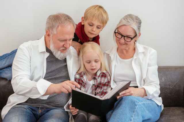 a family looking at a album